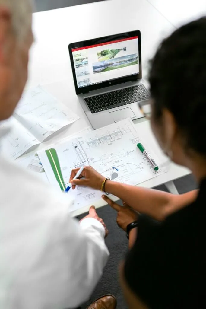 Solar engineer reviewing technical system design documents